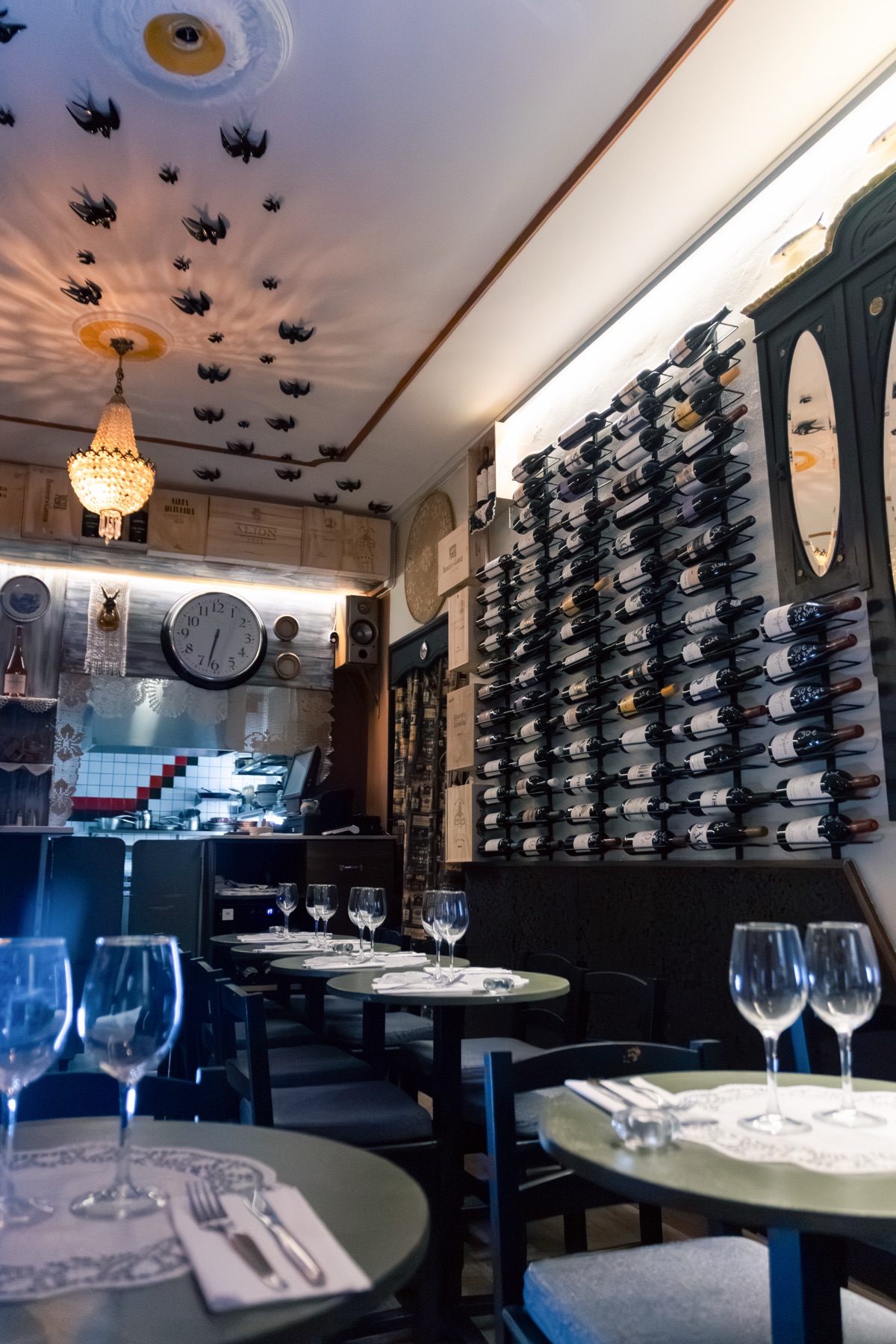 Noémia interior room with wine cellar and dining tables