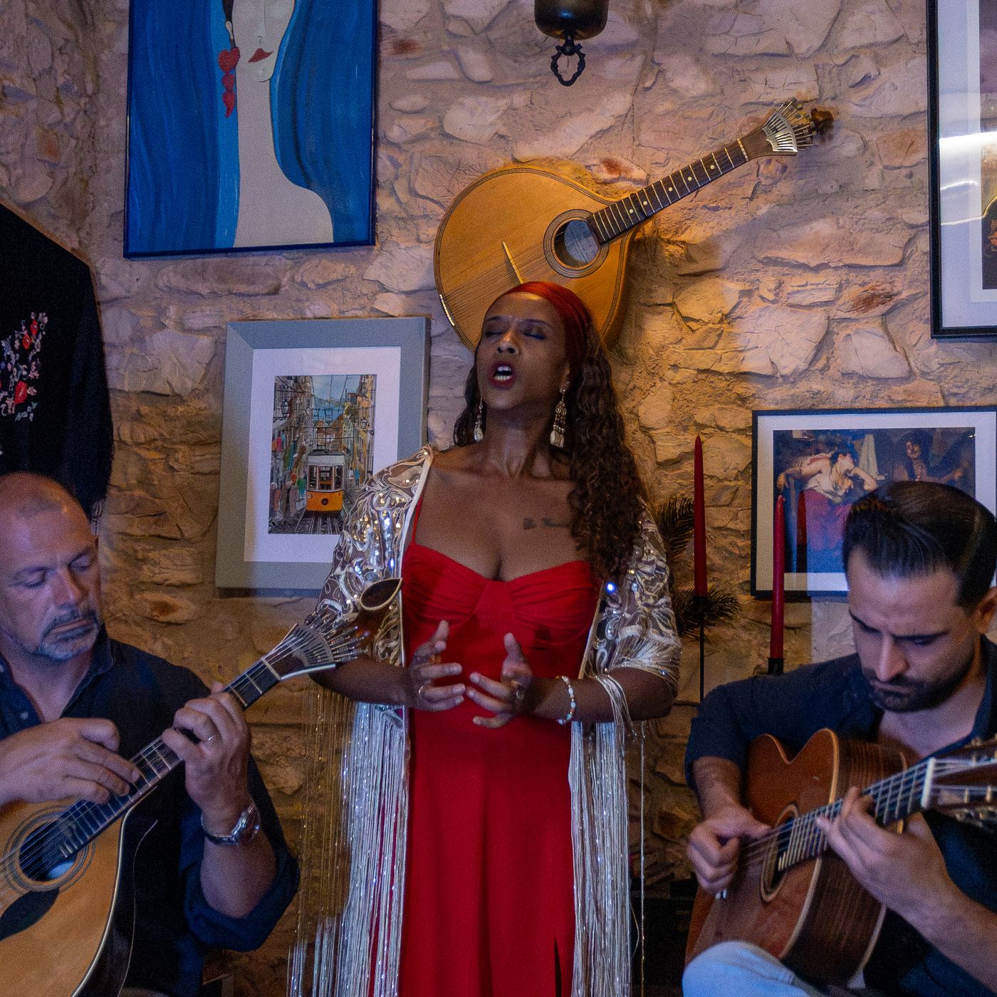 Fado singer with Portuguese guitar on a fado night at Noémia